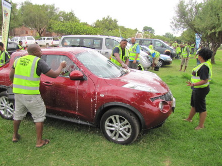 Officials of the Department of Water Affairs washing one of the 62 cars the resident of the Greater Oudtshoorn