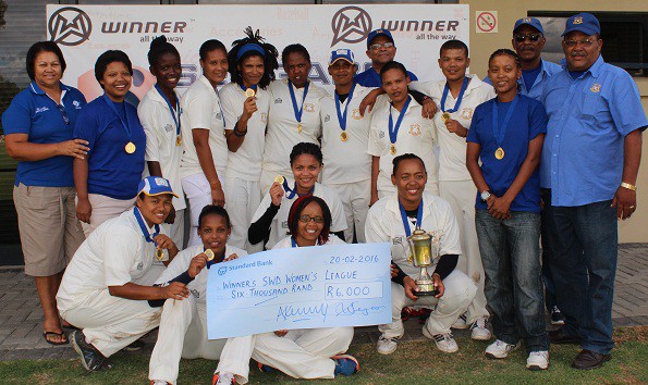 Ms Shireen Noble (Chairperson of the SWD Women’s Cricket Association) with the team of Union Stars that defeated Mossel Bay in the final on Saturday.  They are (Back Row): Katrisha Strydom, Judith Ndlovu, Minoreen Bredenkamp, Michele Afrika, Monique Booysen, Haroline Rhodes (captain), Denzil Erasmus (Executive Member), Celia Baartman, Francisca Bantom, Jenilee Manuel, Chris Andries (Team Manager) and Moses Carolus (Executive Member) Front Row:Bianca Figeland, Micaela Andrews, Hedwigg Pienaar, Jeneviwe Jantjies and Jané Winster  