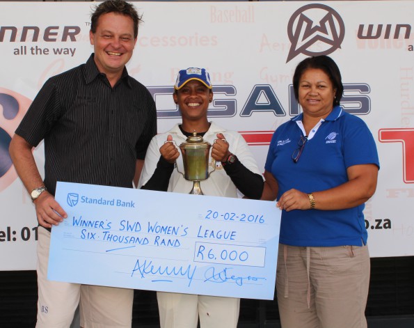 Ms Shireen Noble (Chairperson of the SWD Women’s Cricket Association) hands-over the trophy to Haroldine Rhodes (the captain of Union Stars) after the club defeated Mossel Bay by 117 runs in the final on Saturday.  On the left is Albertus Kennedy (CEO of SWD Cricket)